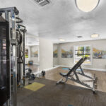 Fitness center with adjustable benches, free weights, and adjustable cable station
