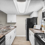 Kitchen with granite counter tops and stainless steel appliances